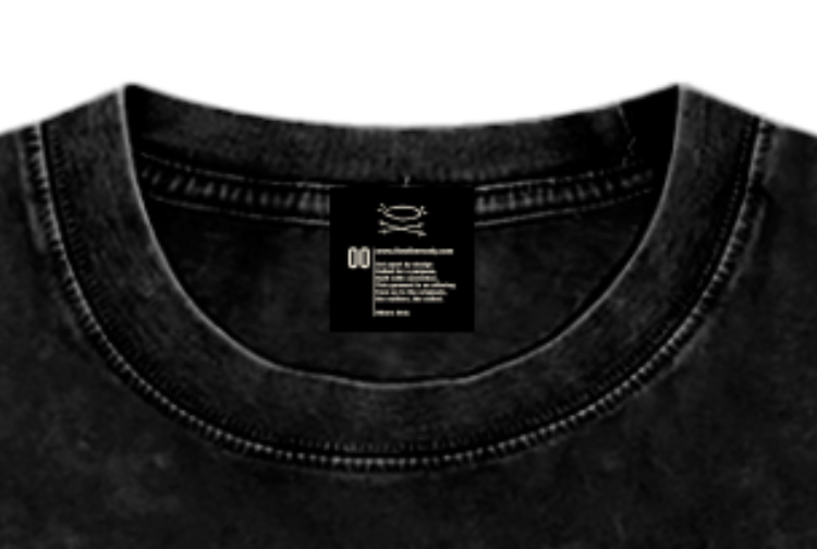 Close detail of the Others Only interior neck label on washed black fabric